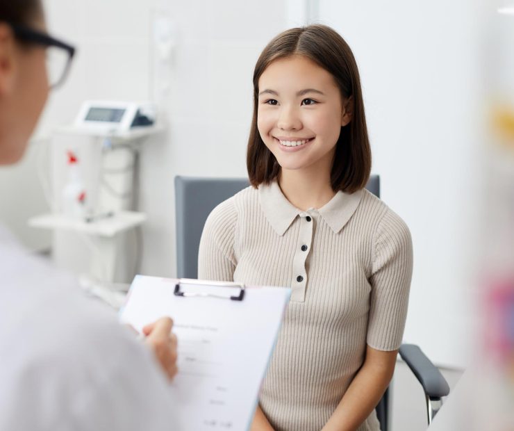 smiling-girl-in-doctors-office-QBNEG28.jpg